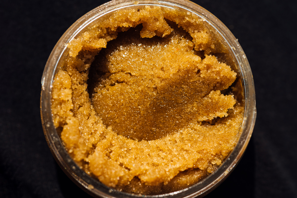 Macro texture of sugar scrub with crystals in a round jar